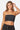 SaltTree model wearing a black Love Poem ribbed seamless strapless tube top with a fitted silhouette.