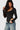 SaltTree Love Poem black long sleeve scoop neck bodysuit with double-layer smoothing fabric on a model in denim jeans