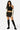 SaltTree Love Poem black high-waisted scuba mini skort with side slit worn by a model with a black crop top and boots