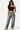 Model wearing a black SaltTree Love Poem double-layered strapless tube top with blue denim jeans