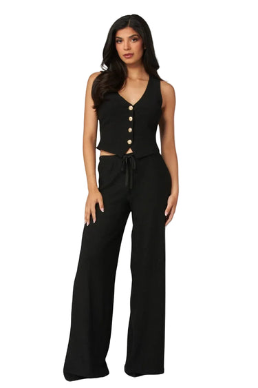 SaltTree Love Poem black waffle-knit two-piece set with button-front vest and high-waisted wide-leg trousers on model