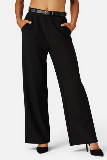 SaltTree Love Poem black high-rise wide-leg scuba knit pants with a belted waist and pockets on a model