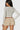SaltTree Love Poem taupe lace bloomer shorts with double-layer ruffles worn by a model in a white long-sleeve top