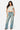 Model wearing a SaltTree Love Poem white double-layered cropped crew neck t-shirt with blue denim jeans