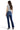 SaltTree Mica Denim mid-rise bootcut jeans in dark indigo with whiskering, worn by a model with a grey t-shirt.