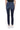 SaltTree Mica Denim dark indigo high rise skinny jeans with a raw step hem, back view on a model wearing white sneakers.