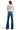 SaltTree model wearing Mica Denim high-rise flared jeans in vintage wash with back pocket detail and long inseam