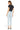 SaltTree model wearing Mica Denim super high rise light wash skinny jeans with a raw hem, viewed from the back.