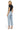 SaltTree model wearing Mica Denim high rise wide leg jeans in icy light blue with a raw hem and cropped ankle length.