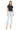 SaltTree model wearing Mica Denim super high rise light wash skinny jeans with a raw hem and a black t-shirt