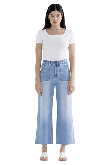 SaltTree Mica Denim light wash super high rise wide leg cropped jeans with front patch pockets on a model