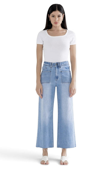 SaltTree Mica Denim light wash super high rise wide leg cropped jeans with front patch pockets on a model.