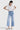 SaltTree model wearing Mica Denim light wash super high rise cropped wide leg jeans with a white ribbed top