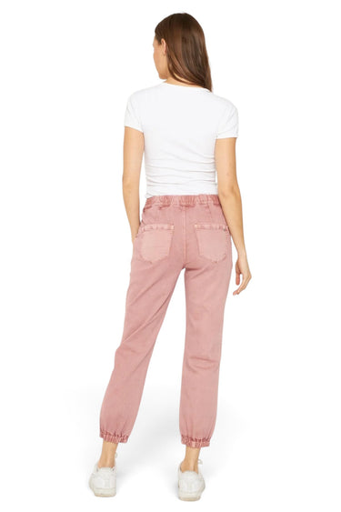 SaltTree Mica Denim high rise pink jogger pants with cuffed ankles and back pockets worn by a model from behind.