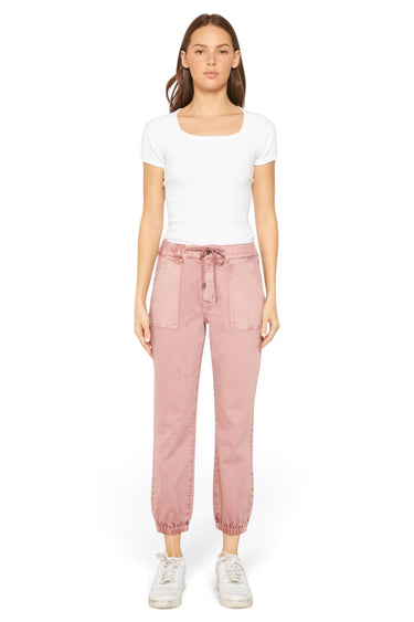 SaltTree model wearing Mica Denim pink high rise jogger cropped pants with cuffed ankles and drawstring waist.