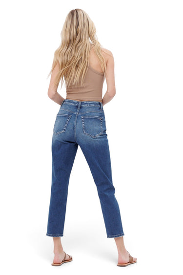 SaltTree Mica Denim Tokaji mom jeans in medium-dark wash with raw hem, worn by a blonde model from the back view.