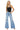 SaltTree model wearing Mica Denim light wash high rise super wide leg jeans with distressed knees and raw hem.