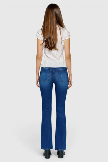 SaltTree ONE HUNDRED B high rise bootcut jeans in medium wash denim seen from the back on a model