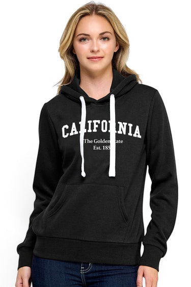 SaltTree Reflex black fleece pullover hoodie with white California embroidery and drawstring hood on a female model