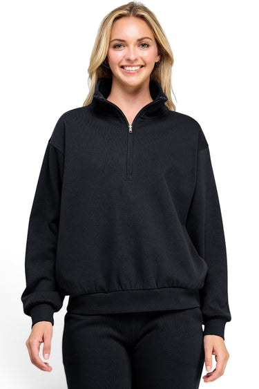 SaltTree Reflex black fleece half-zip pullover with a mock neck collar worn by a smiling model