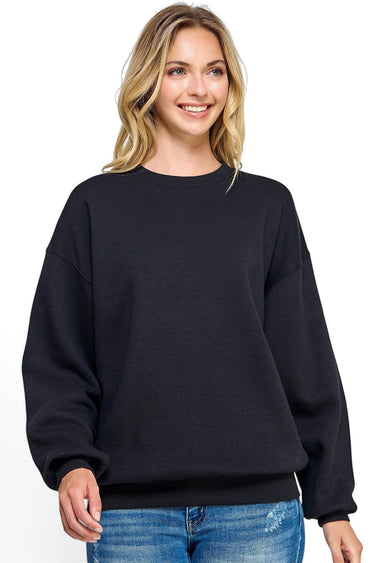 SaltTree Reflex black fleece crew neck sweatshirt with a relaxed oversized fit worn by a smiling model.