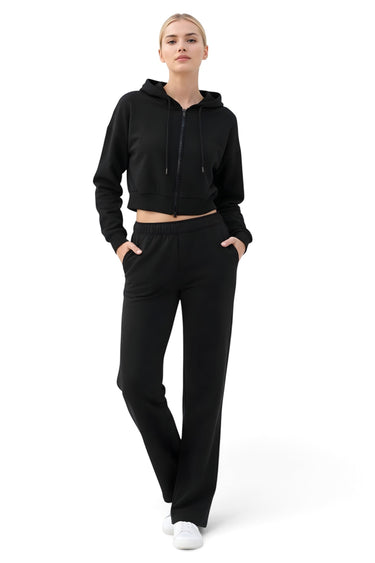 SaltTree Reflex black scuba knit cropped zip-up hoodie worn by a model with matching black lounge pants