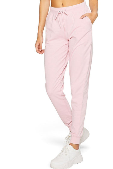 SaltTree Reflex pink French terry boyfriend joggers with a drawstring waist and banded cuffs worn by a model.