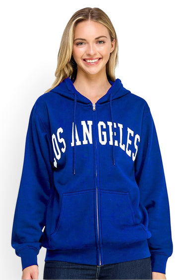 SaltTree Reflex royal blue oversized fleece zip-up hoodie with white Los Angeles varsity print on a smiling model