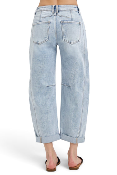 SaltTree Risen Jeans high-rise boyfriend barrel jeans in light indigo denim with curved seams and cuffed hems, back view.