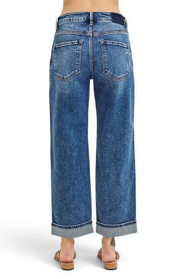 Back view of SaltTree Risen Jeans high-rise barrel-leg denim in light indigo with a thick turn-up cuffed hem.
