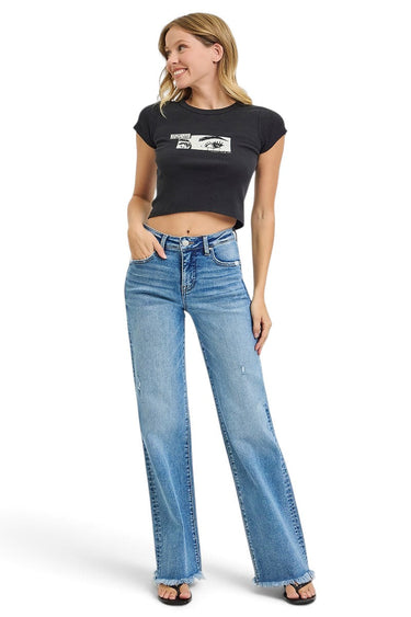 SaltTree model wearing Risen Jeans high rise straight leg denim with tummy control, medium wash, and frayed raw hem.