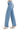 SaltTree Risen Jeans high-rise wide baggy denim in medium wash with tummy control and clean hem, side profile view.