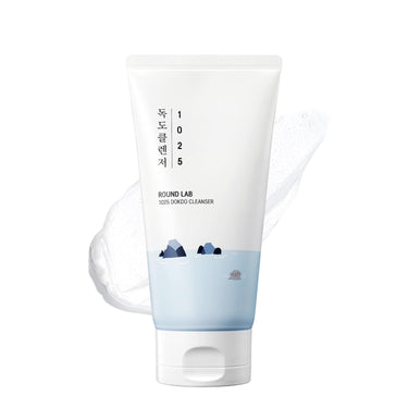 SaltTree Round Lab 1025 Dokdo Cleanser in a white squeeze tube with a blue sea illustration and creamy texture swatch.