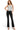 SaltTree model wearing Wax Jean low-rise black potassium wash bootcut jeans with a grey tank top
