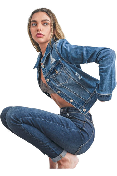 SaltTree Wax Jean medium blue cropped destructed denim trucker jacket worn by a model in a crouching pose