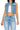 SaltTree Wax Jean medium blue cropped boxy denim vest with destroyed details, button front, and chest pockets.