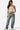 SaltTree model wearing a white Love Poem double-layered strapless tube top with blue jeans and sneakers.