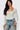 SaltTree model wearing a white Love Poem long sleeve scoop neck bodysuit with a supportive double-layer fit