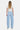 SaltTree light wash denim barrel leg jeans with a super high rise and full length finished hem, worn by a model.