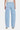 SaltTree light wash denim jeans with a super high rise, long barrel leg, and finished hem. Features seam detail on hips and thighs.