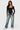 Love Poem contour scoop neck long sleeve bodysuit in black on a model