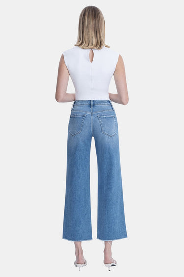 SaltTree Flying Monkey medium wash high rise slim wide leg jeans with raw hem and distressed detailing.