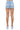 SaltTree American Bazi medium blue wash denim shorts with back pockets, shown from behind on a model