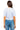 Back view of SaltTree American Bazi cropped baseball jersey in white with blue pinstripes on a model