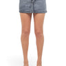 SaltTree American Bazi black wash mini denim skirt with rhinestone trim and button closure on a model