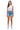 Model wearing SaltTree American Bazi medium blue wash denim shorts with rhinestone accents and a white tank top.