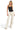 SaltTree ANWND black ribbed halter neck bodysuit with side cutouts worn by a blonde model with cream wide-leg trousers