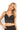 SaltTree ANWND black floral lace bralette top with V-neckline, adjustable straps, and a scalloped hem on a model.