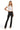 Model wearing SaltTree ANWND black high-waisted ponte flare pants with a white crop top and heels