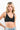 SaltTree ANWND black ribbed V-neck cami bra top worn by a blonde model against a white background